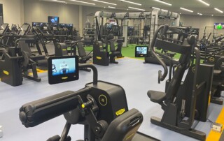 A photo of a gym showing a variety of fitness machines